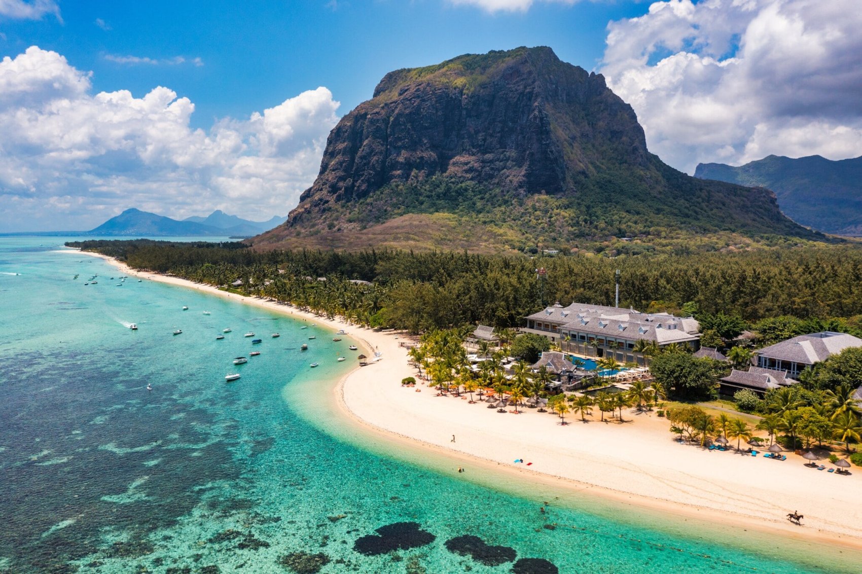 Turquoise lagoon, white sand and mountain scenery in Mauritius